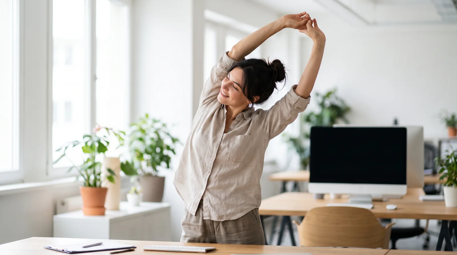 A person standing up from their desk for a short movement break